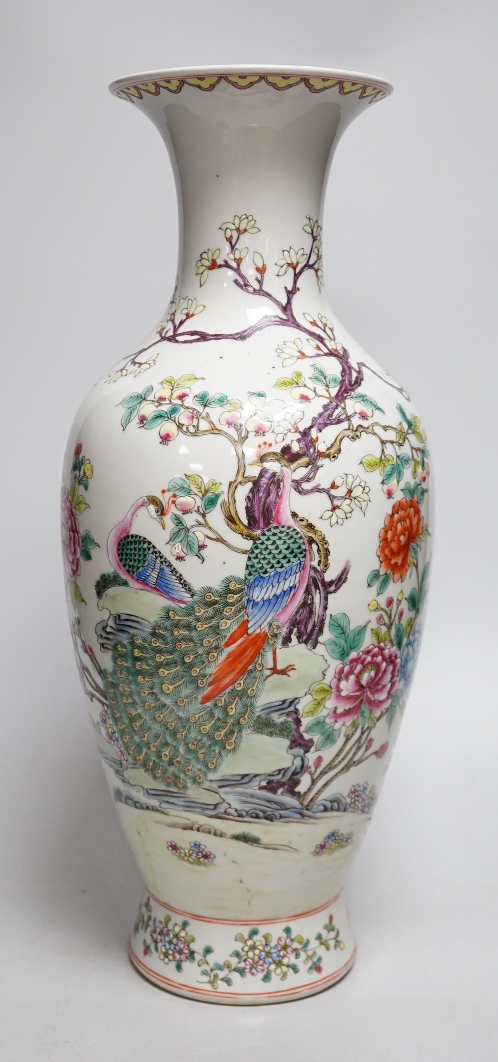 A large Chinese famille rose peacock vase. 46cm tall
